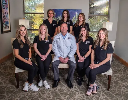 The Grand Dental Studio team with Dr. Kirk in the waiting area.
